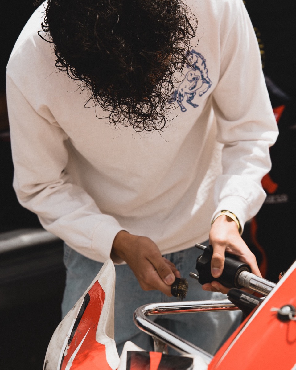 A team member working on the steering of a kart