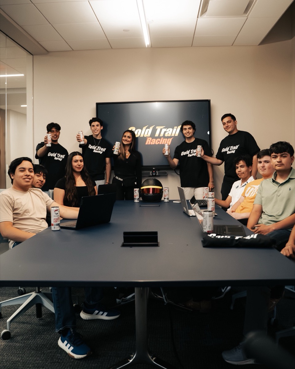The whole team together in a meeting room